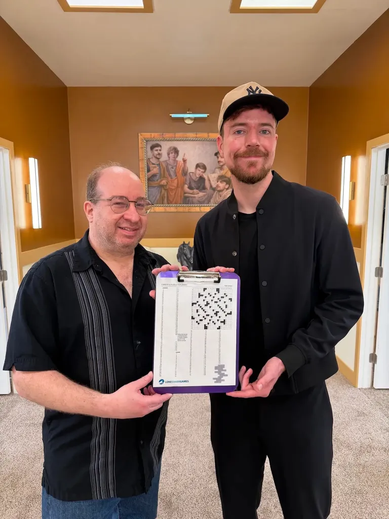Jimmy & Mike holding a crossword puzzle.